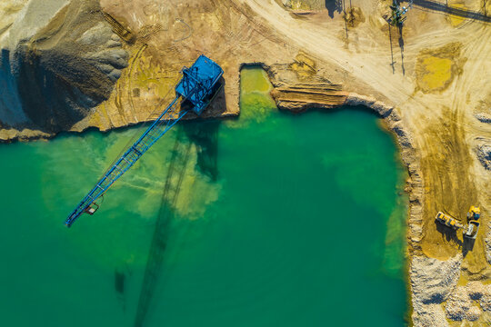 Aerial view of a blue crane operating on a quarry in Blackberry Township in Illinois, United States of America.