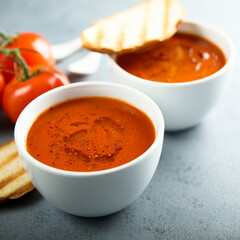Homemade spicy tomato soup with grilled bread