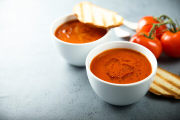 Homemade spicy tomato soup with grilled bread