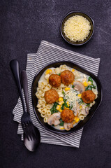 Pasta with vegetables and meatballs