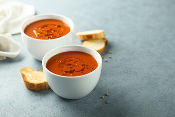 Homemade spicy tomato soup with grilled bread