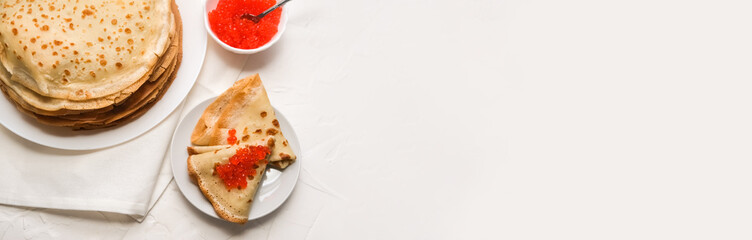 thin pancakes with red caviar on white napkin. The concept of the Russian carnival Maslenitsa. space for text, banner