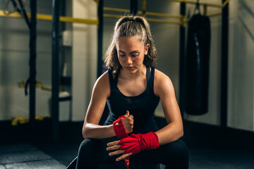woman preparing for training in gym