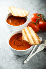 Homemade spicy tomato soup with grilled bread