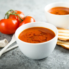Homemade spicy tomato soup with grilled bread
