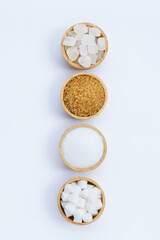 Various types of sugar on white background.