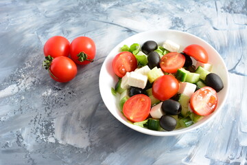 fresh vegetable salad with tomatoes and feta
