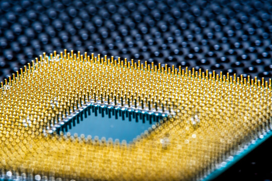 Close-up of a part of a microprocessor in soft focus under high magnification. Details of a computer component under a microscope.
