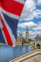 Big Ben with flag of England in London, England, UK