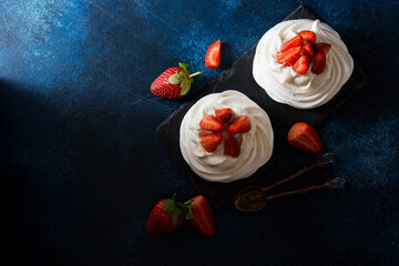 Anna Pavlova cake with cream and strawberries, top view