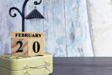 Day 20 of february month, Wooden calendar with date. Empty space for text.