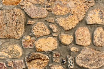 cobblestone pattern, close-up stone wall, cobblestone masonry, stone background