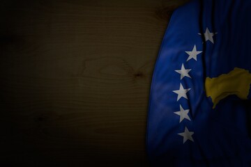 beautiful any celebration flag 3d illustration. - dark illustration of Kosovo flag with large folds on dark wood with empty space for your content
