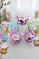 Beautiful Easter cakes on a decorated light table. A light holiday of Easter.