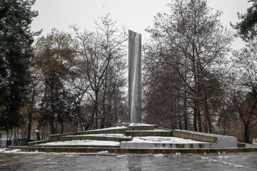 monument at snow covered park