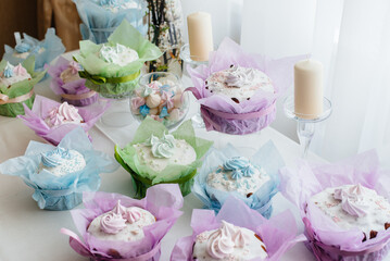 Beautiful Easter cakes on a decorated light table. A light holiday of Easter.