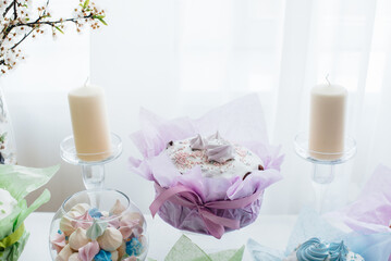 Beautiful Easter cakes on a decorated light table. A light holiday of Easter.