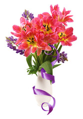 Bouquet of coral tulip flowers in a vase with purple satin ribbon isolated on white