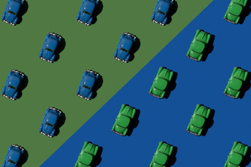 Toy retro blue and green cars in seamless pattern on green and blue background. 