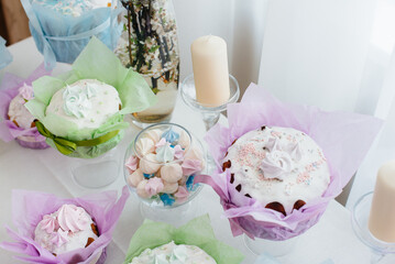 Beautiful Easter cakes on a decorated light table. A light holiday of Easter.