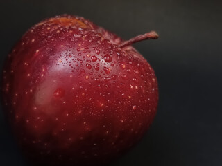red apple with water drops