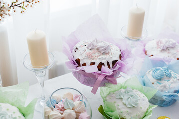 Beautiful Easter cakes on a decorated light table. A light holiday of Easter.