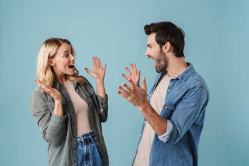 Young beautiful man and woman wondering and looking at each other