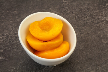 Marinated peaches fruit in the bowl