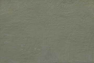 Dirty green painted stucco wall. Background texture