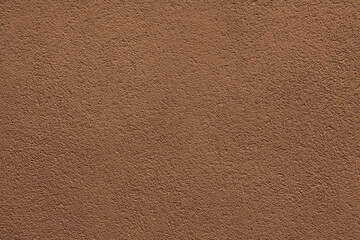 Brown painted stucco wall.