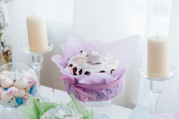 Beautiful Easter cakes on a decorated light table. A light holiday of Easter.