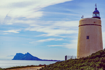 Lighthouse and Gibraltar rock, La Alcaidesa, Spain.