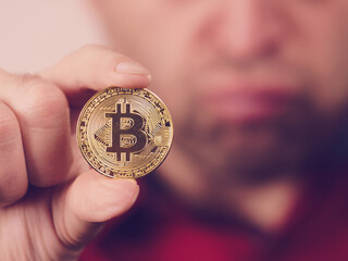 Man having bitcoin coin