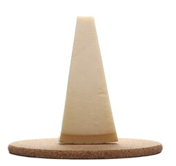 Cheese wedge, Italian Grana Padano block on cork mat, plug isolated on white background