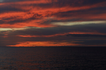 Beautiful sunset on the Ionian coast looking at the Calabrian mountains