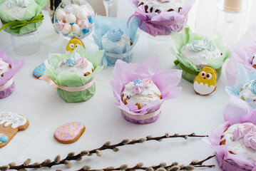 Beautiful Easter cakes on a decorated light table. A light holiday of Easter.