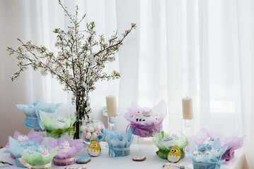 Beautiful Easter cakes on a decorated light table. A light holiday of Easter.