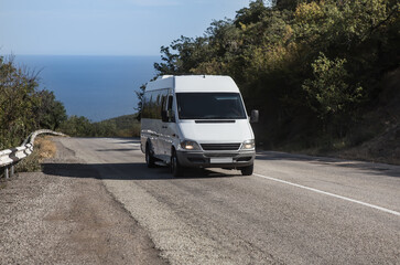 Minibus Moves on the road from the sea