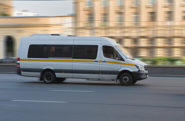 minibus goes on the city street