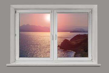 View from the window to the sea mountainous coast at sunrise