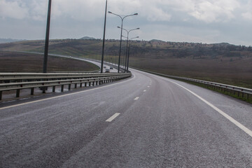 Wet suburban highway after rain