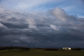 Obraz na płótnie Canvas Skåne landscape in winter with large clouds