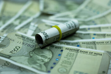 Indian Currency Rupees. Rolls of Five Hundred Note Indian rupee money.