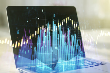 Multi exposure of abstract creative financial graph on modern computer background, forex and investment concept