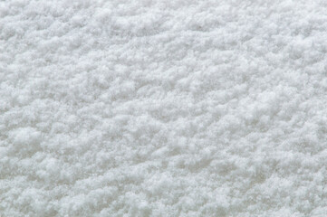 Fototapeta na wymiar winter background: fresh clean even snow, large snowflakes