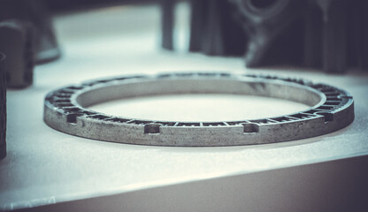 Man is holding object printed on metal 3d printer.