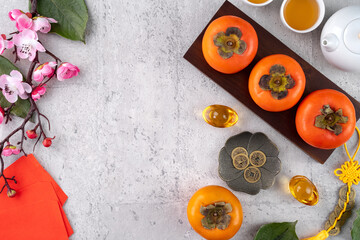 Top view of persimmons on gray table background for Chinese lunar new year