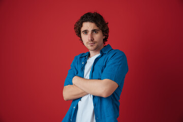 Caucasian handsome man posing with arms crossed