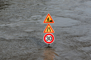 Road signs covered with water during the flood in Paris. France.