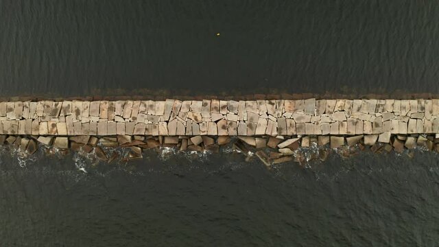 Aerial Top Down Tracking Drone footage over Rockland Maine Breakwater